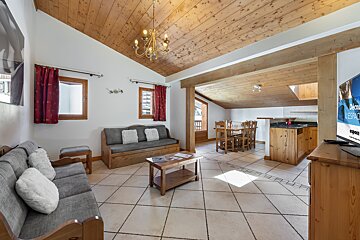 A living room with a couch and a flat screen tv