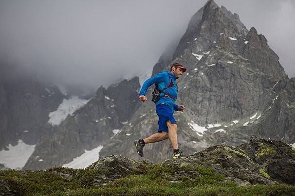 a man running in the mountains