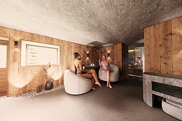 Two women relax in a warm, wood-paneled spa lounge with stone accents and modern chairs. A cozy, inviting atmosphere.