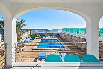 A view of a swimming pool from a balcony