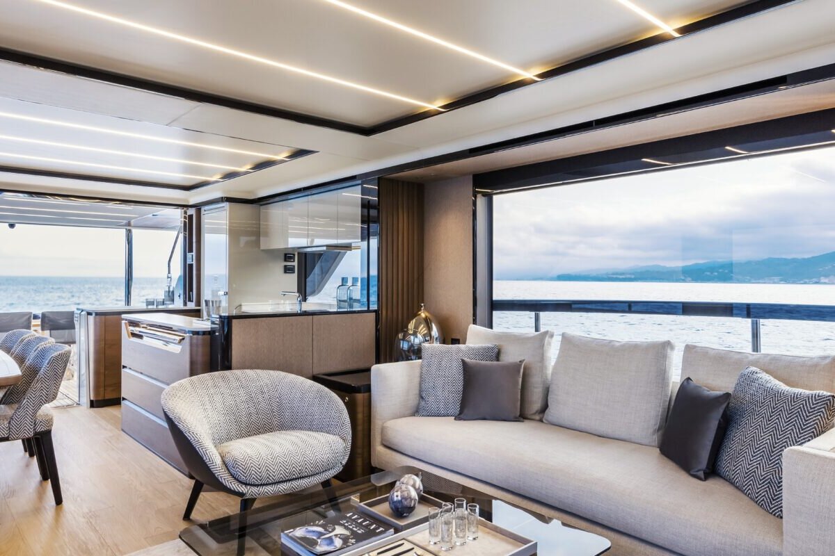 A living room with a couch a chair and a coffee table with a book on it that says 