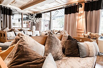 A couch with a lot of pillows on it