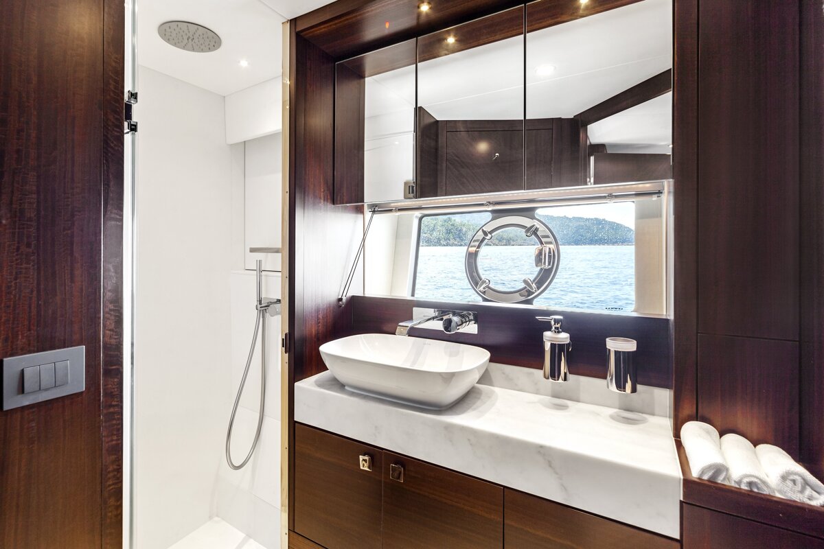 A bathroom with a sink a mirror and a window