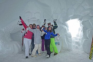 a group of people in an ice cave