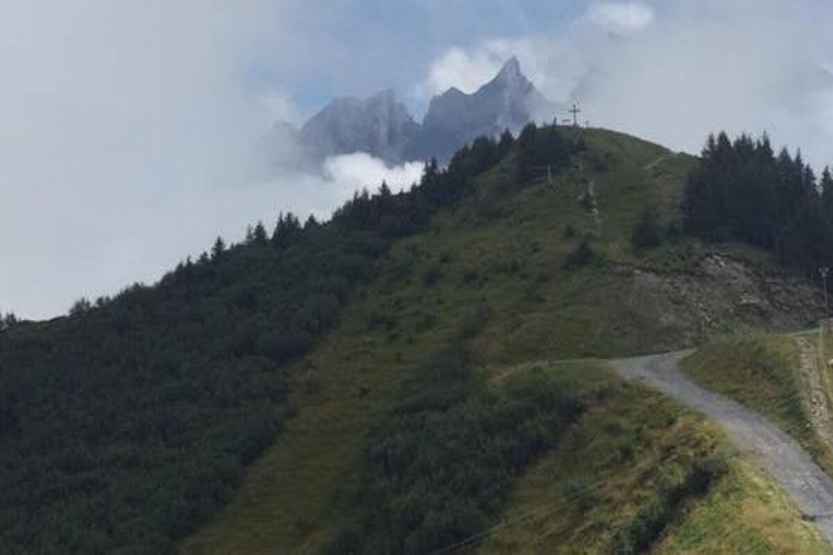 mountain peaks appearing through the clouds