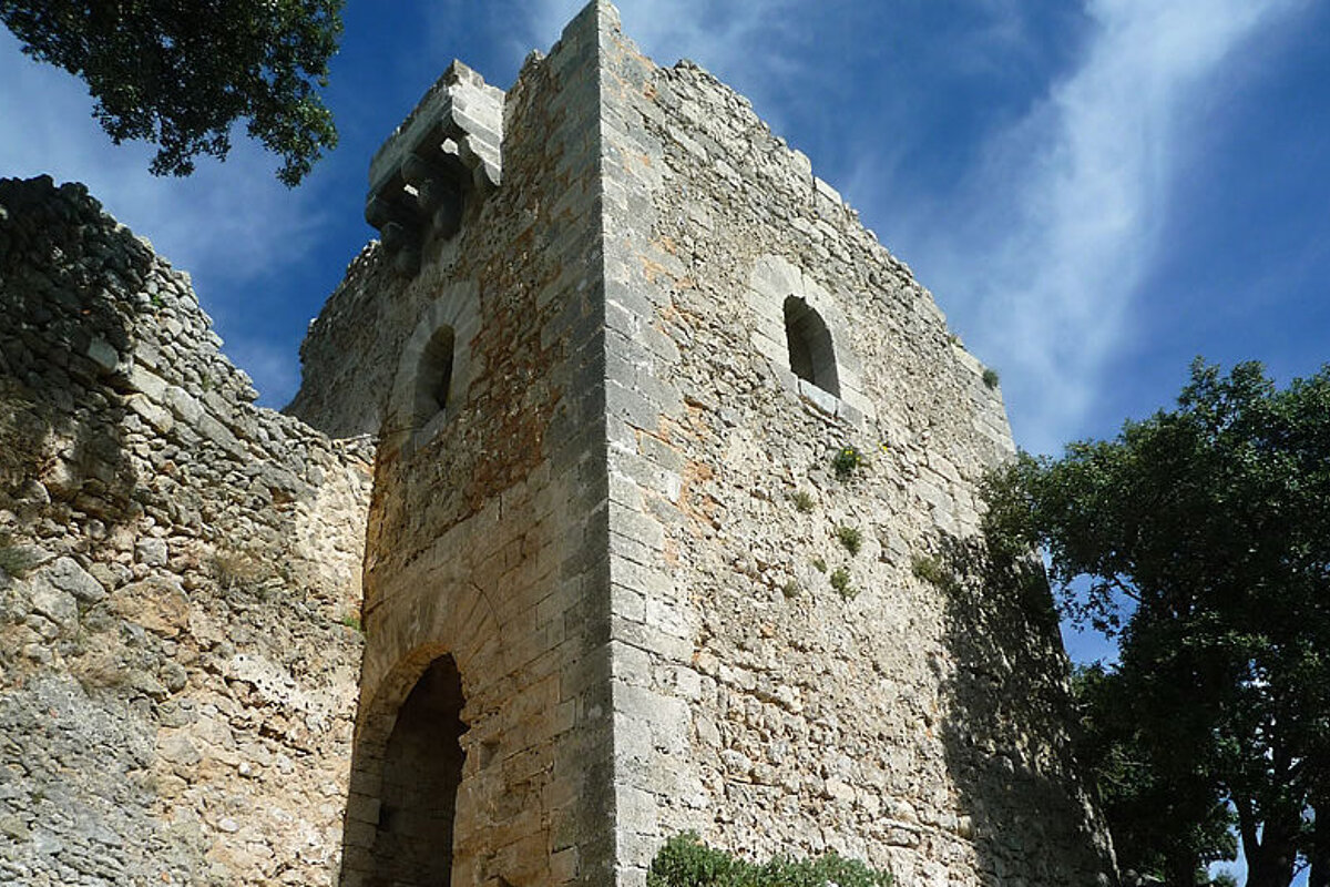 A stone tower with a blue sky in the background