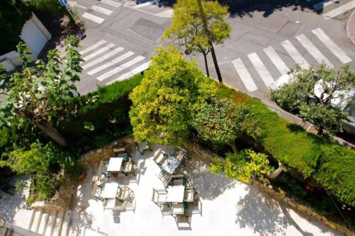 An aerial view of a patio with tables and chairs