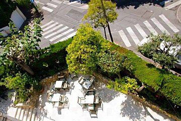 An aerial view of a patio with tables and chairs
