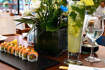 rolls of sushi and a cocktail