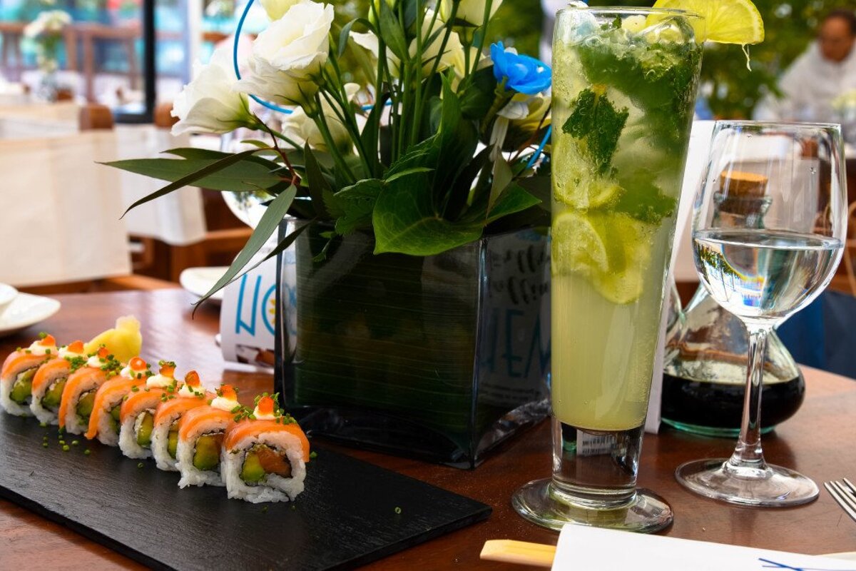 rolls of sushi and a cocktail