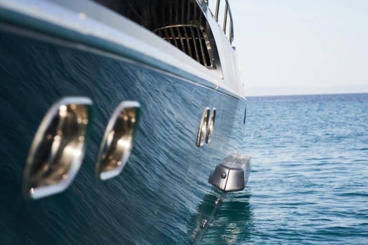 A yacht is floating on top of a body of water