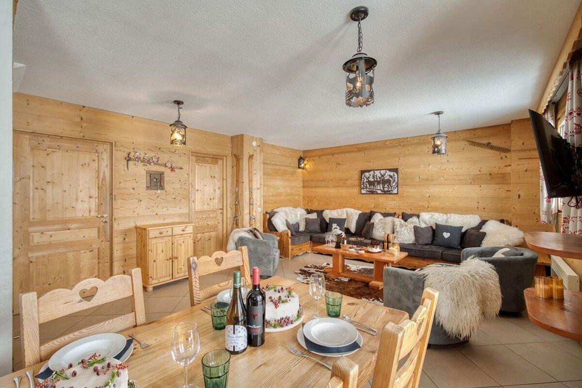 A bottle of wine sits on a table in a living room