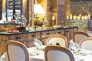 A table set for a buffet with desserts on it