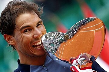 rafa Nadal and his trophy