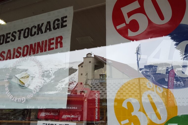 sales signs in a shop window