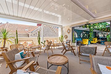 A room with a lot of chairs and tables