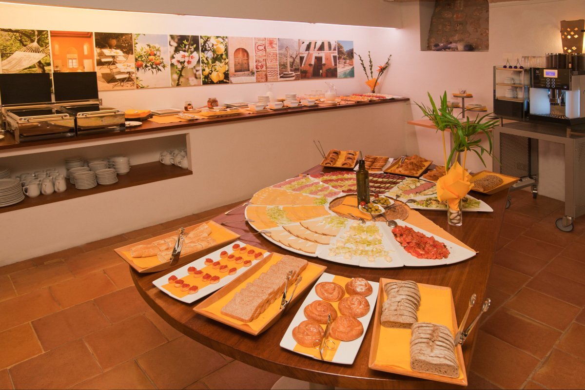 A buffet table with a lot of food on it