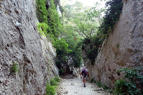 someone walking in a deep canyon in provence