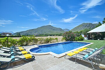 A large swimming pool with mountains in the background