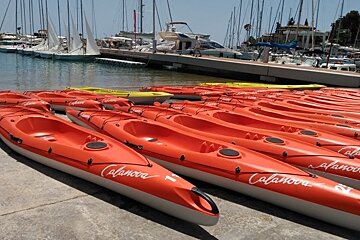 red kayaks lined up on the port in mallorca