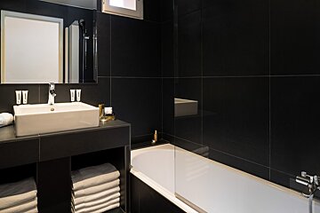 A bathroom with a sink and a bathtub