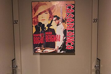 A poster for the movie casablanca hangs on a door