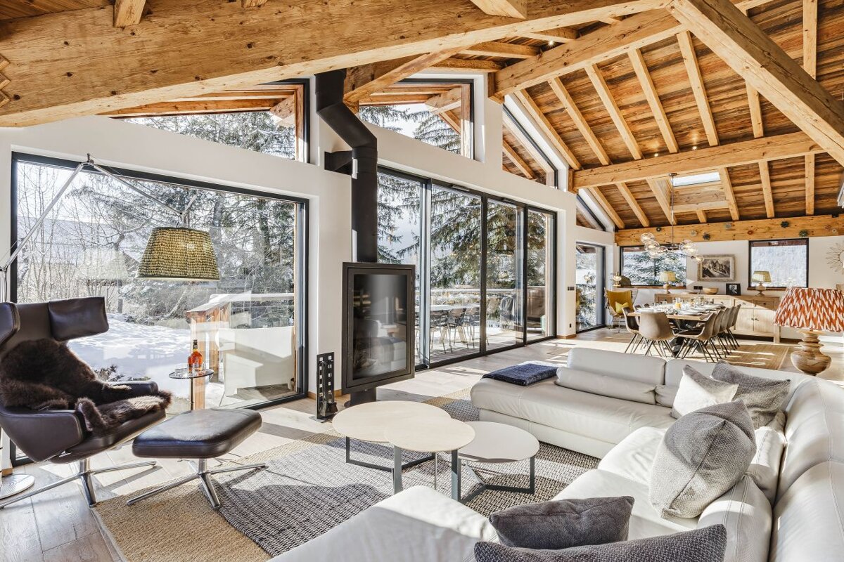 A living room with a couch a chair and a fireplace