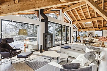 A living room with a couch a chair and a fireplace
