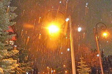 snow falling at night