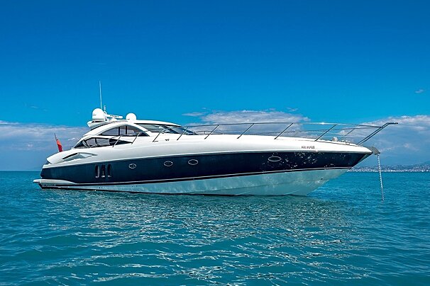 A white and dark blue luxury yacht named 
