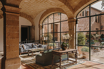 A room with a couch and a table in it