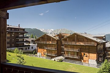 A view of a mountain range from a balcony