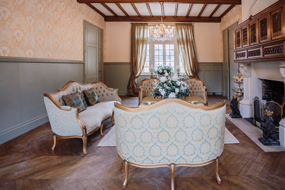A living room with two couches and a fireplace