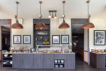 A buffet area with a clock on the wall above it