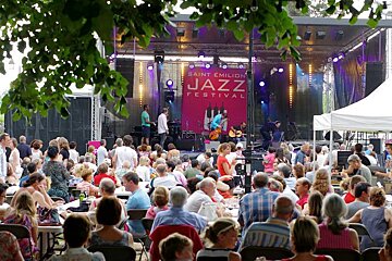 crowds in front of an outdoor stage