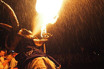 a demon breathing fire on the streets of mallorca
