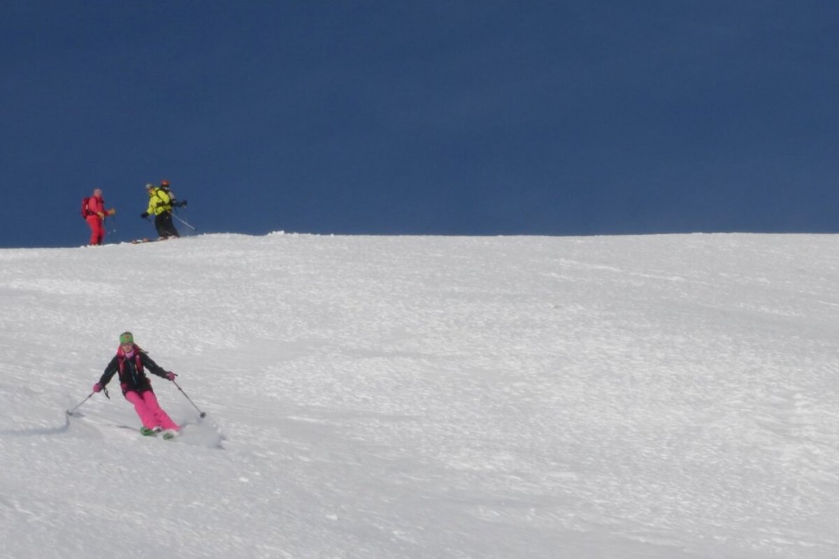 a girl skiing down the mountains