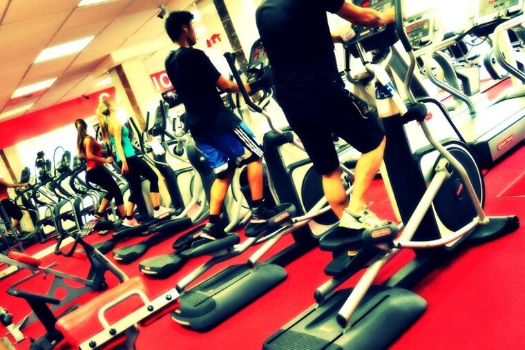 people using equipment in a gym