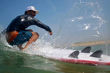 surfer in the waves, lacanau bordeaux region
