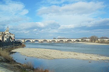 a view along the river to the town & bridge of Pont St Esprit