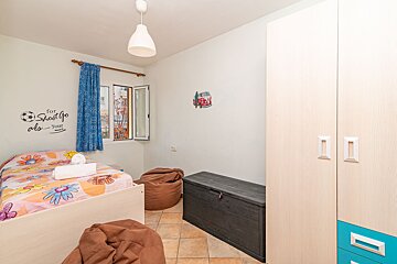 A bedroom with a sticker on the wall that says