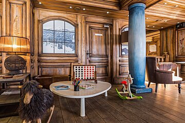 A children 's room with a table and a rocking horse