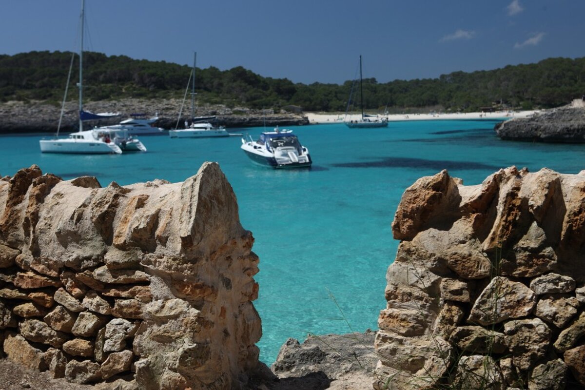 boats in the sea by mondrago park majorca