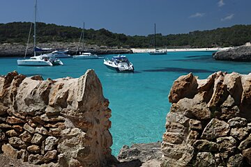 boats in the sea by mondrago park majorca