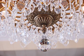 A close up of a chandelier with crystals hanging from it