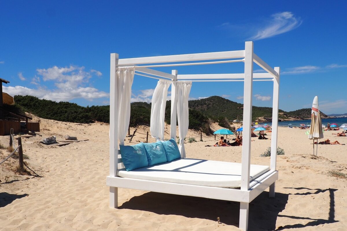 a cabana bed on es cavallet beach in ibiza