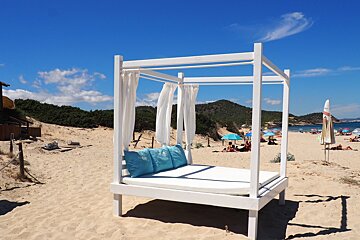 a cabana bed on es cavallet beach in ibiza