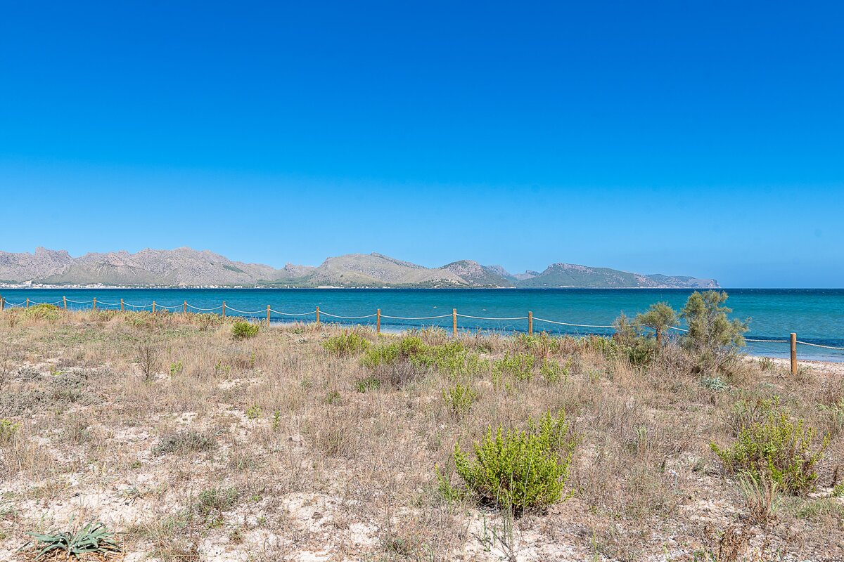 A view of the ocean with mountains in the background