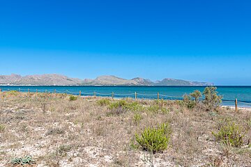 A view of the ocean with mountains in the background