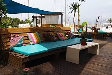 wooden benches with colourful cushions